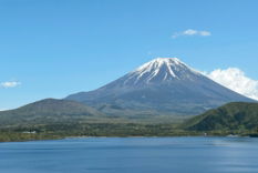 a-large-body-of-water-with-a-mountain-in-the-background.jpg a large body of water with a mountain in the background